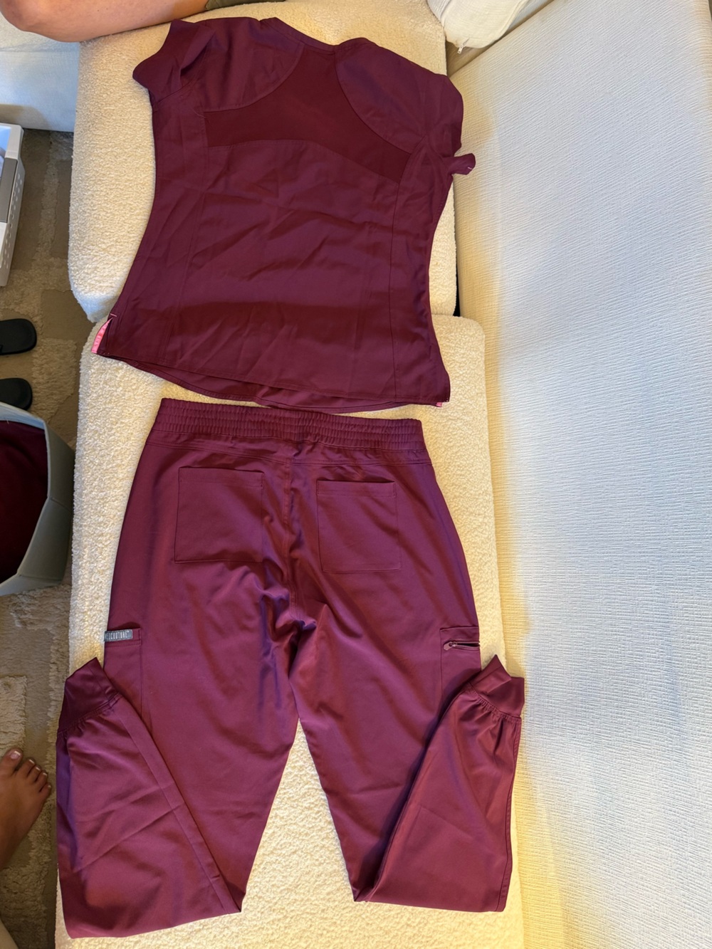 Med Couture Burgundy Scrub top and jogger bottoms.Pocket Details